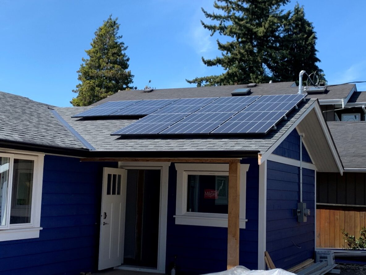 A residential home roof has one side of solar panels
