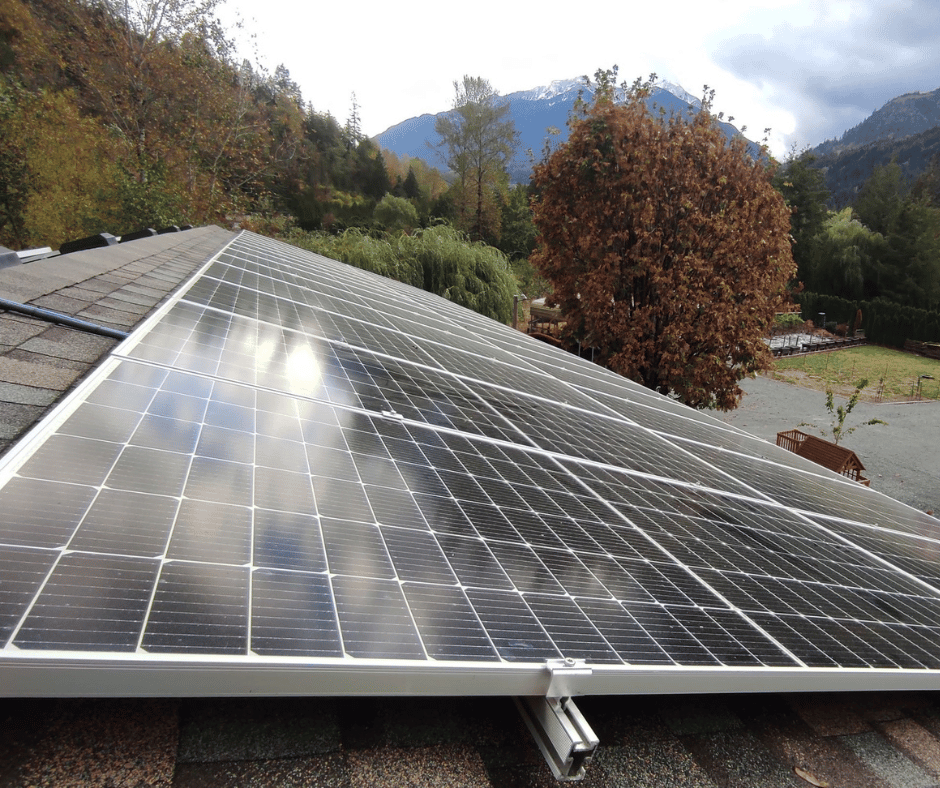 Image of solar panels on top of residential roof, installed by Rikur Energy